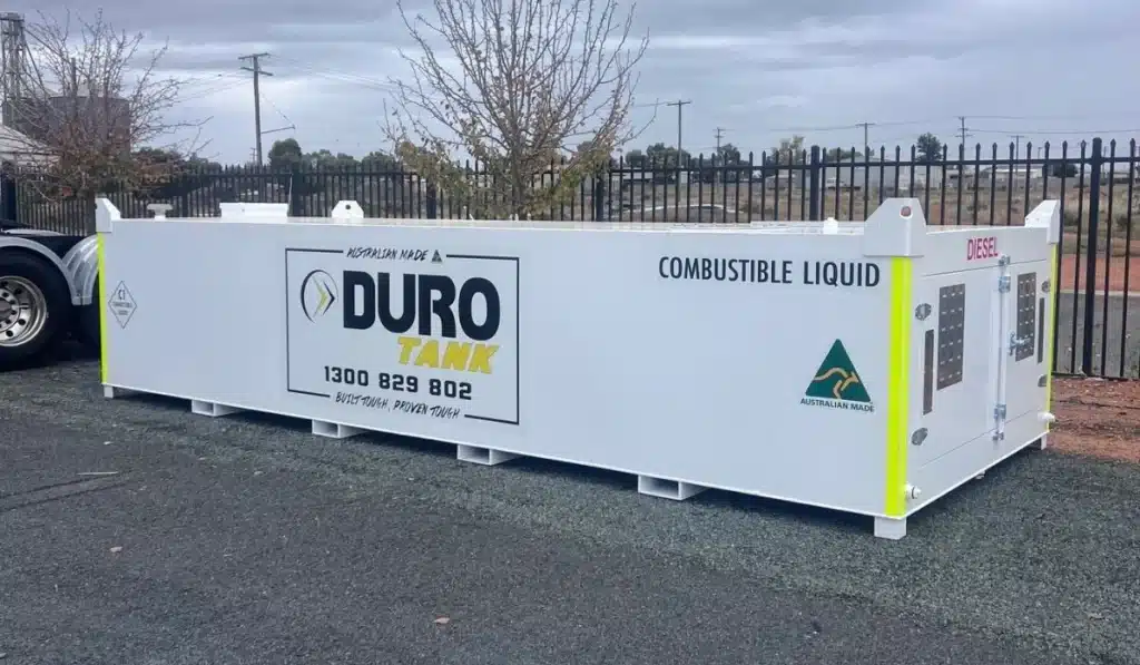 Side profile of a Durotank self-bunded diesel fuel tank with integrated lockable pump cabinet, Australian Made certification and combustible liquid signage for secure bulk fuel storage.