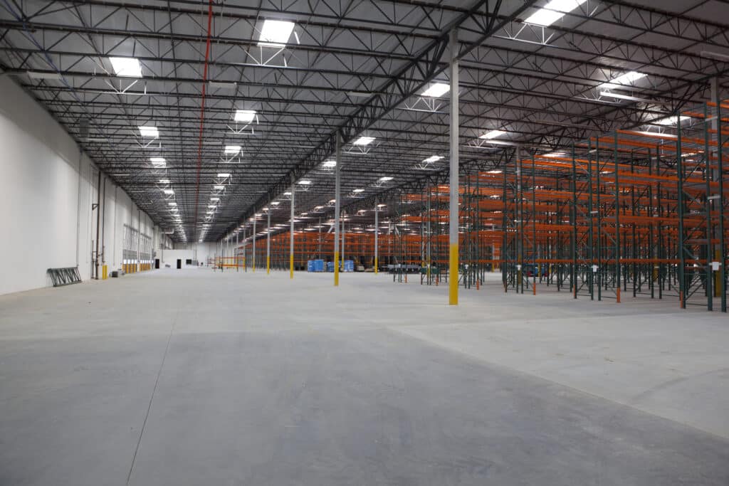 A huge empty warehouse with empty racks